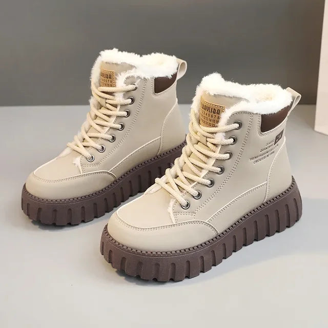 Women's beige plush-lined lace-up ankle boots with a chunky brown sole, shown on and off a model with black jeans.