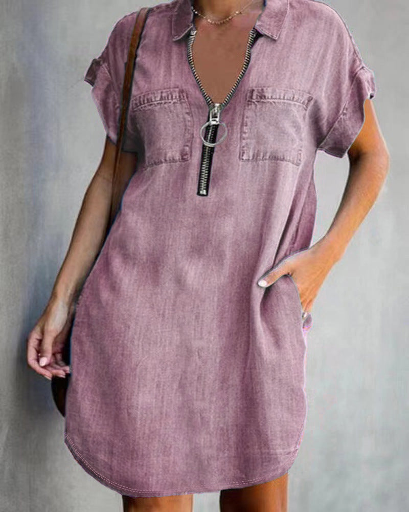 Model wearing a loose-fit lapel denim-style shirt dress in mid-length
