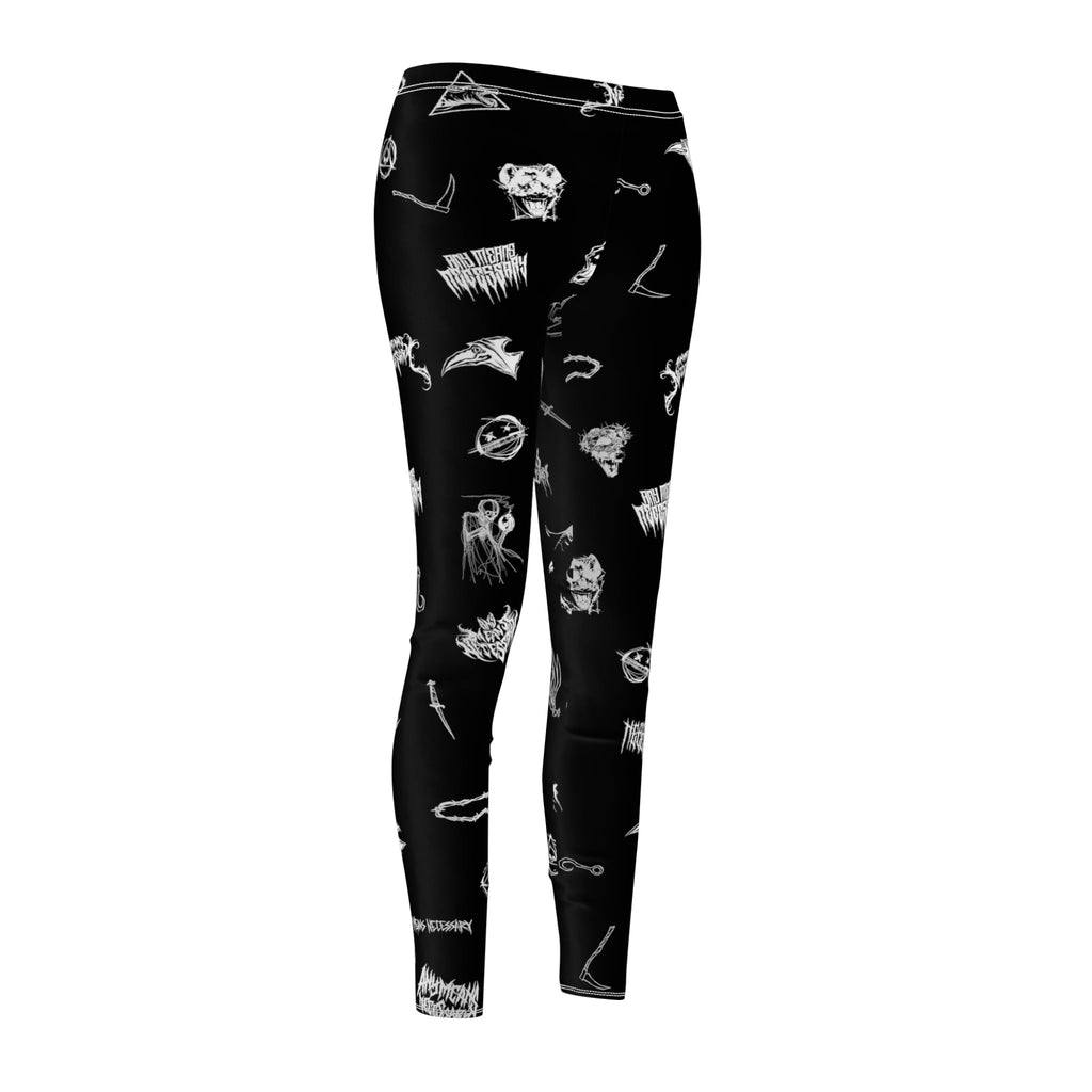 A pair of black leggings with white gothic and horror-inspired graphic prints displayed against a plain background.