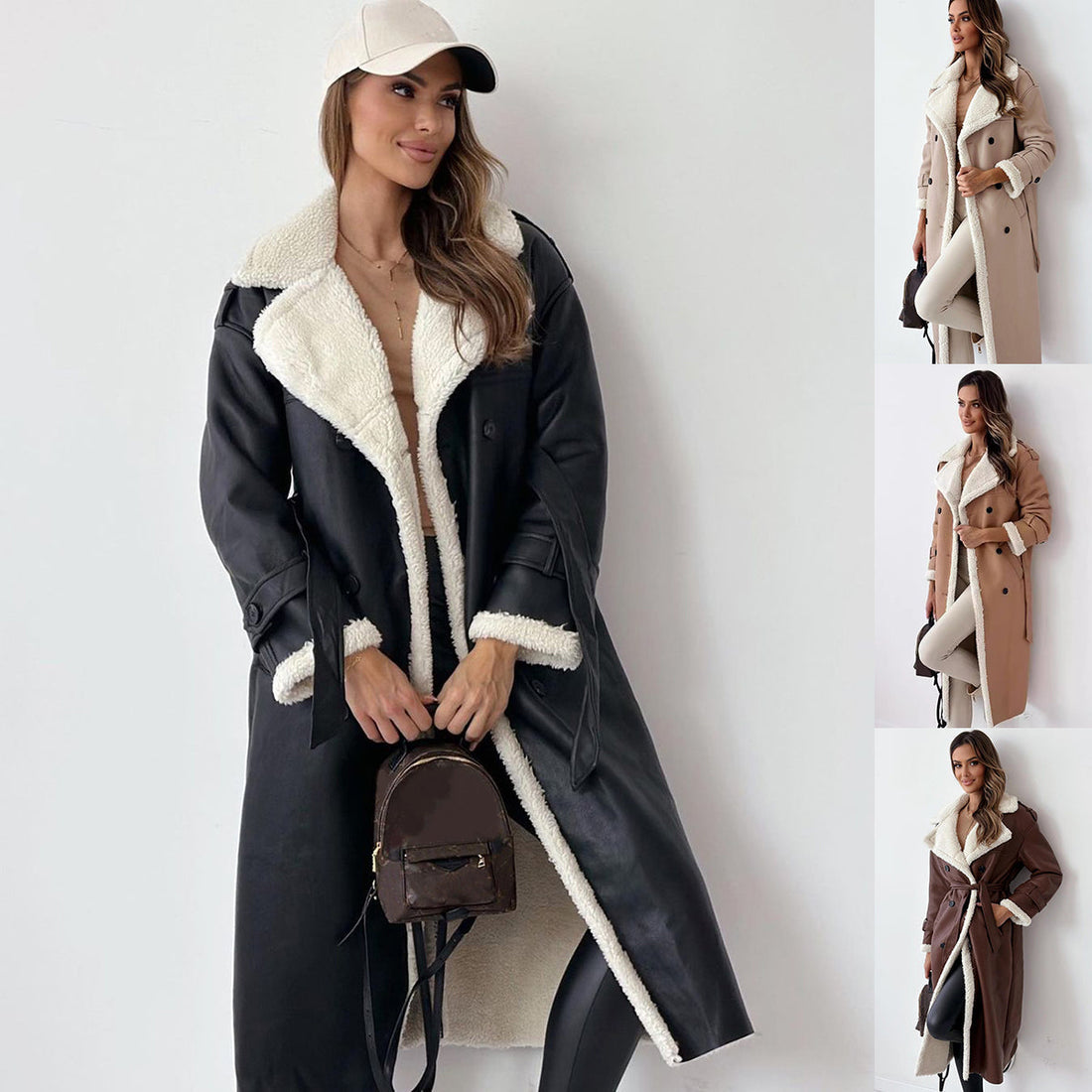 A woman wearing a long black double-breasted faux leather trench coat with cream sherpa lining and a matching belt.