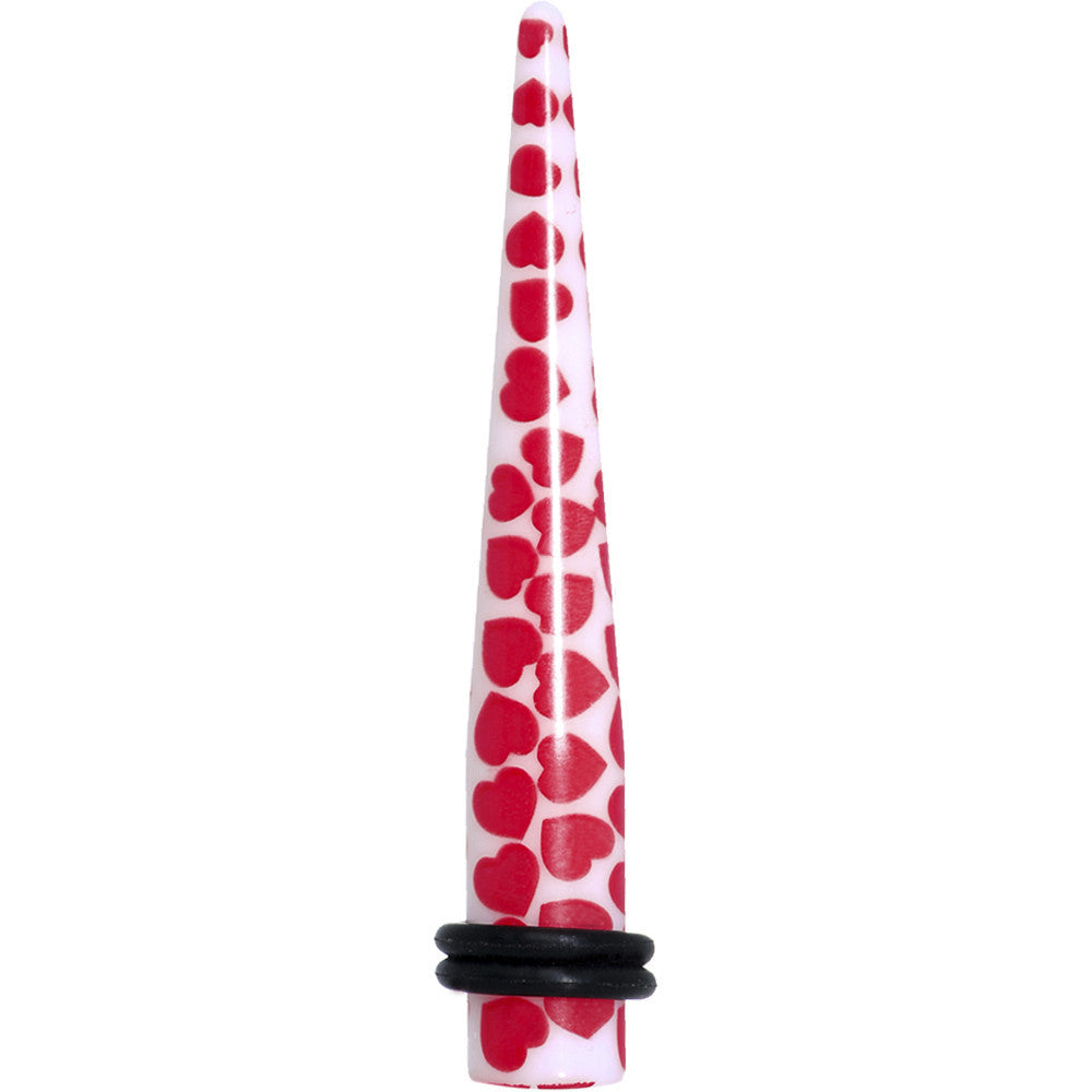 0 Gauge white acrylic ear taper featuring a red heart pattern with two black rubber O-rings