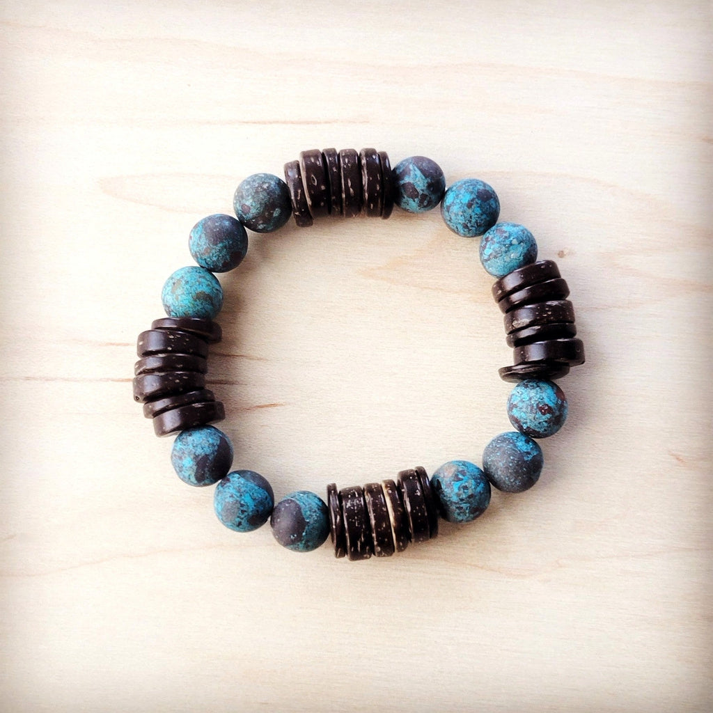 Natural American turquoise and brown wood beaded stretch bracelet on a plain background