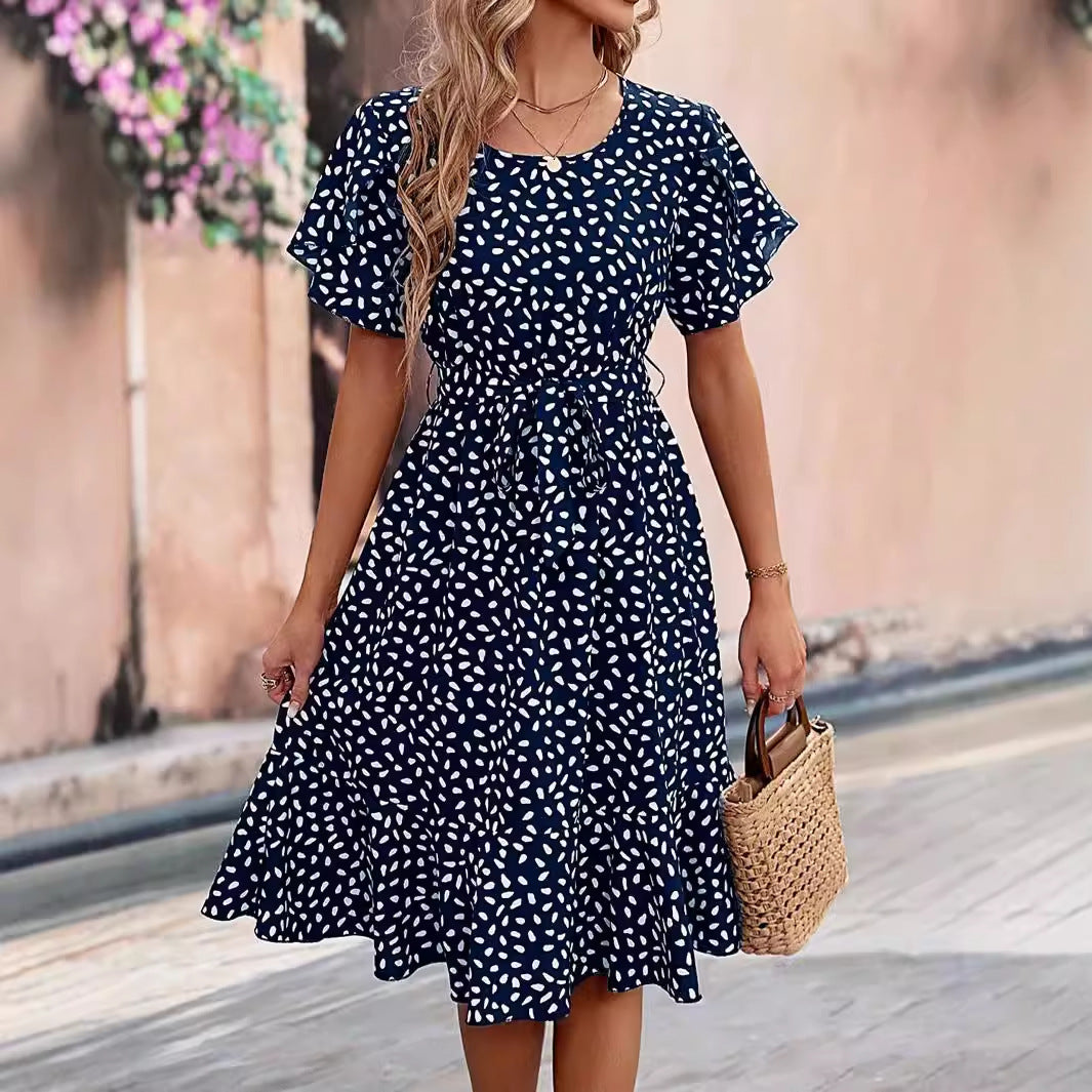 A stylish dark blue short sleeve midi dress with a floral print, perfect for street style looks.
