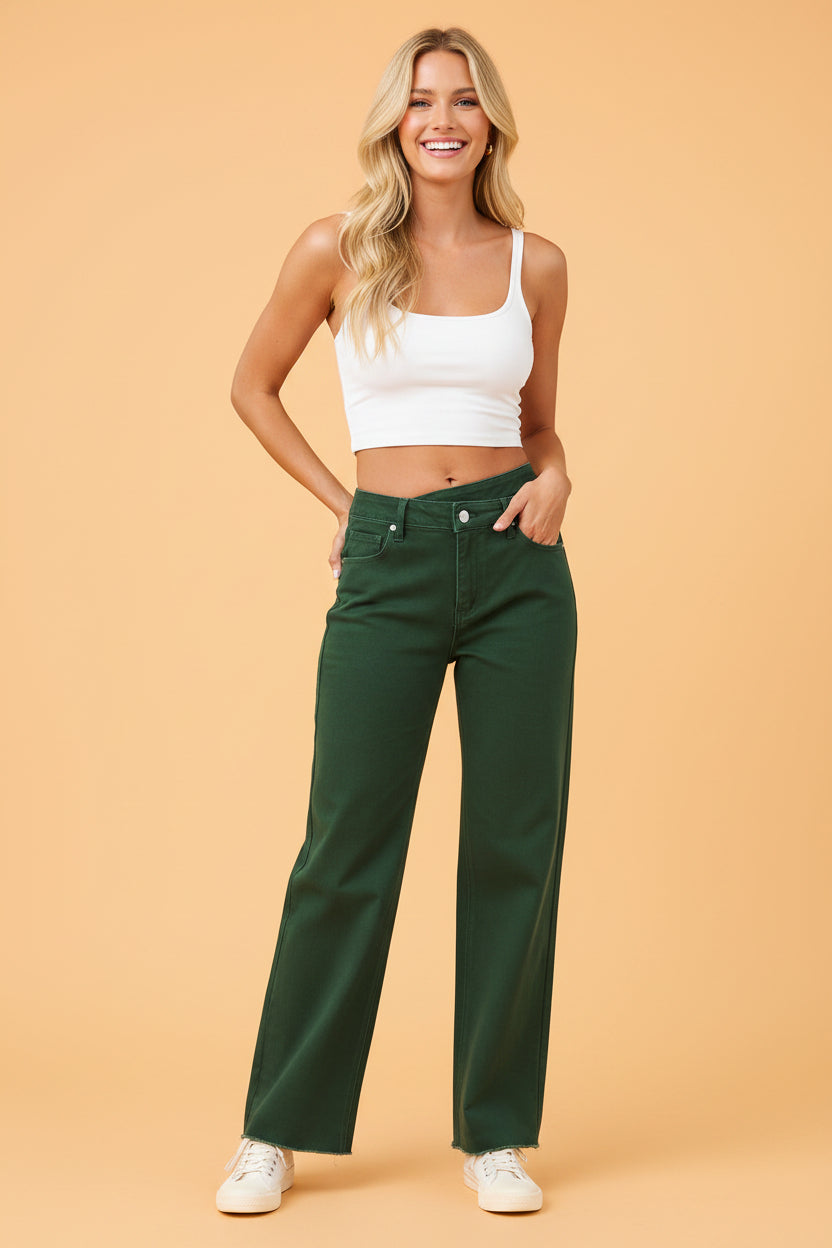 Dark green denim jeans with crossed waist detail and raw hem styling