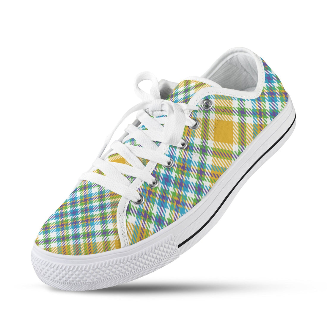 A pair of yellow plaid patterned low top canvas sneakers for women with white laces and white rubber soles.