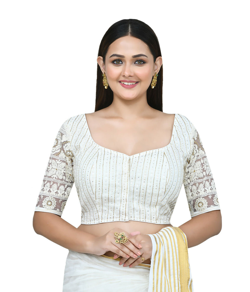 Close up of a women's white art silk stitched blouse with detailed embroidery work