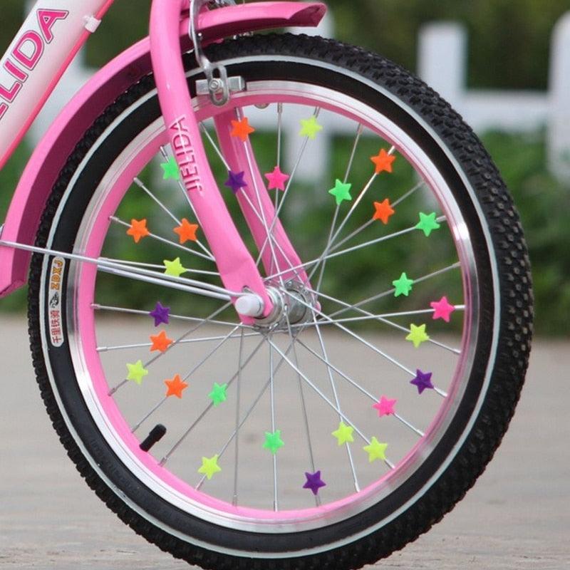 Colorful plastic beads clipped onto bicycle wheel spokes for kids bike decoration