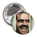 A 1-inch pop-culture button featuring Jack Nicholson on a multi-color background.
