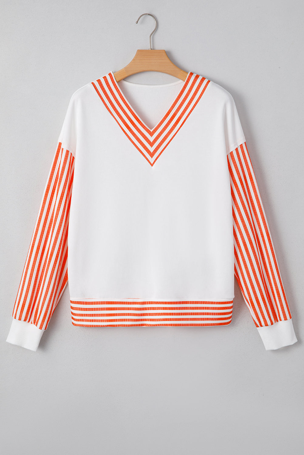 White Long Sleeve Top with Orange Striped Accents and V-Neck