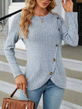 Close-up of a model wearing a light blue vertical ribbed knit long sleeve top with decorative buttons on the side.
