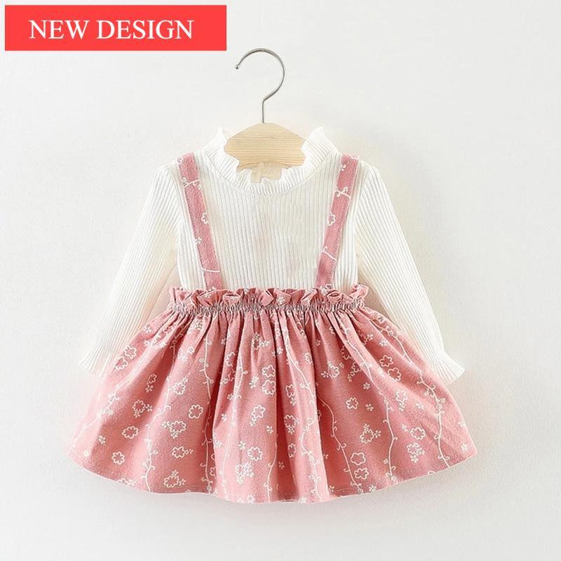 Girls 2-piece outfit with long sleeve polka dot top and a cat-themed strap dress.