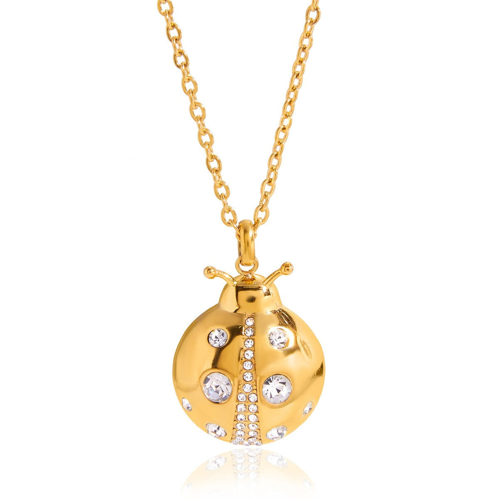 Vera Lux 18k gold ladybug necklace and matching earrings with zircon accents