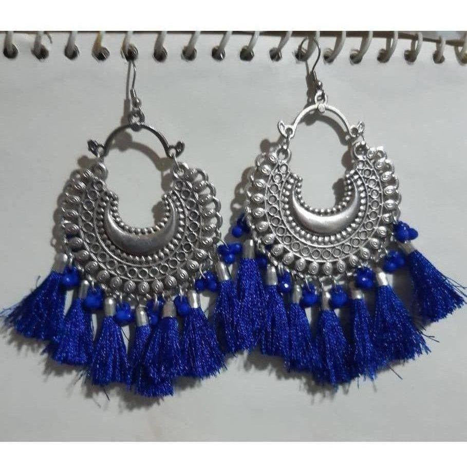 Half moon silver oxidized earrings featuring vibrant blue silk thread accents