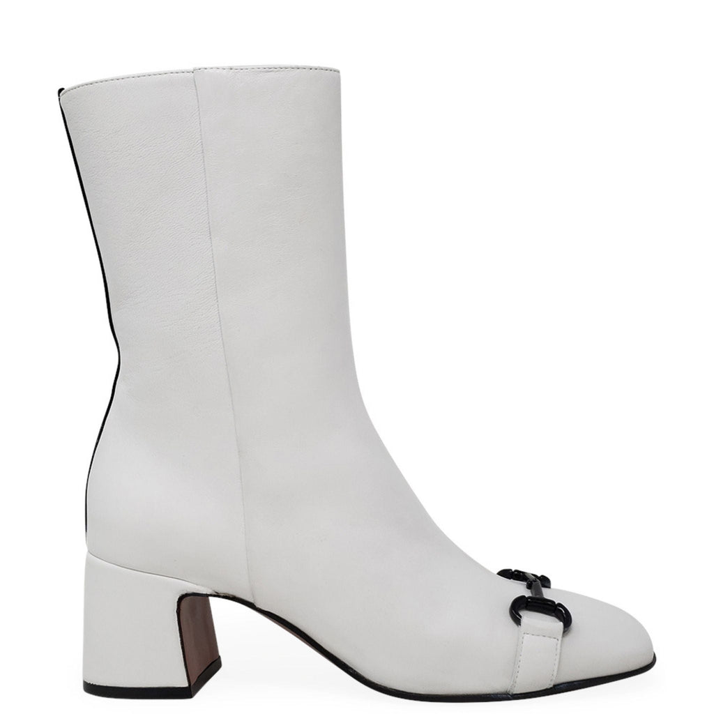 A pair of white leather boots with a 2-inch block heel, black back stripe, and horsebit hardware detail