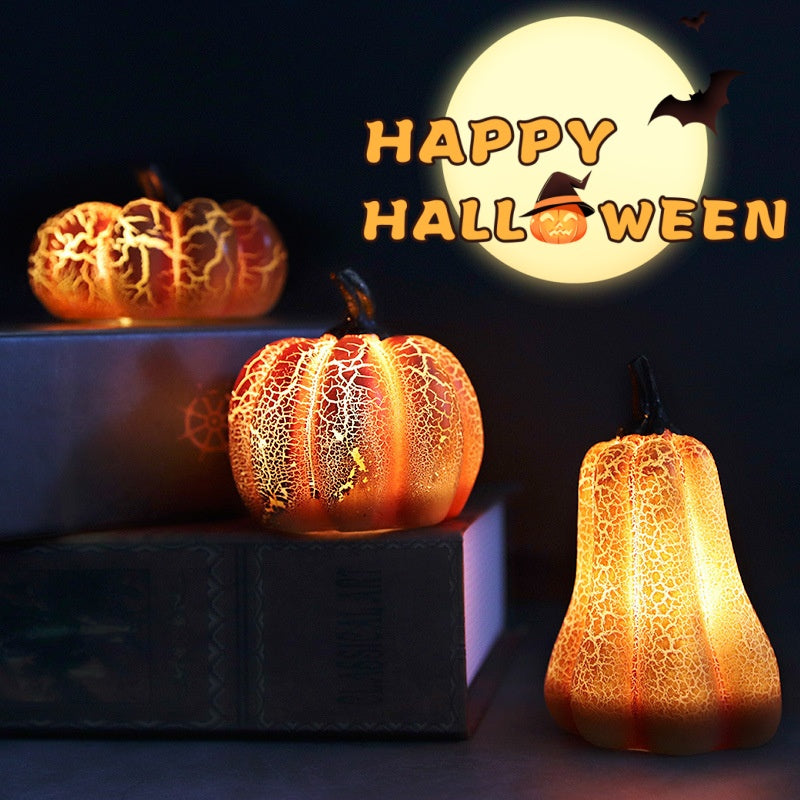 Realistic resin Halloween pumpkin lantern with glowing LED candle inside, placed on a wooden porch surface.