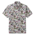 Close up of a men's button-down shirt featuring a detailed Jacobean-inspired floral print in forest-green and burgundy.