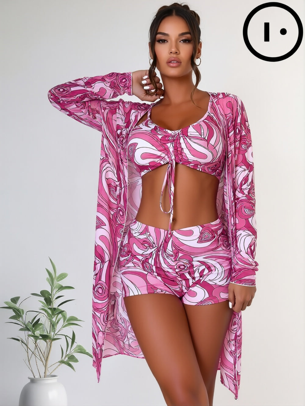 Model wearing a modern two-piece swimsuit with abstract pattern