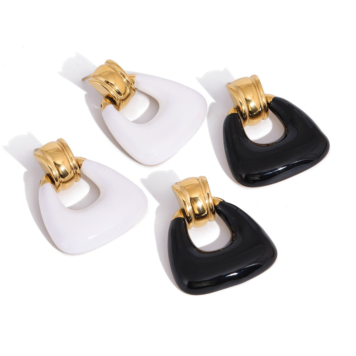 Minimalist 18K gold stud earrings featuring delicate enamel details.
