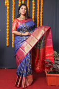 Blue Kanjivaram Silk saree with Zari woven patterns and contrast red blouse