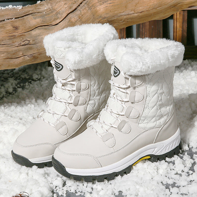 Harajuku Style Women's insulated white snow boots with faux fur lining and quilted detailing, worn in snow.