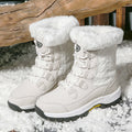 Harajuku Style Women's insulated white snow boots with faux fur lining and quilted detailing, worn in snow.