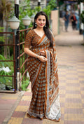 Mustard color poly georgette Ajrak saree with aari mirror work detail