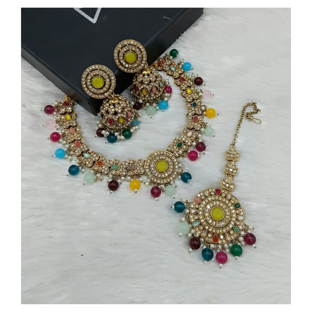 Multi-stone statement necklace set with matching drop earrings on a clean background