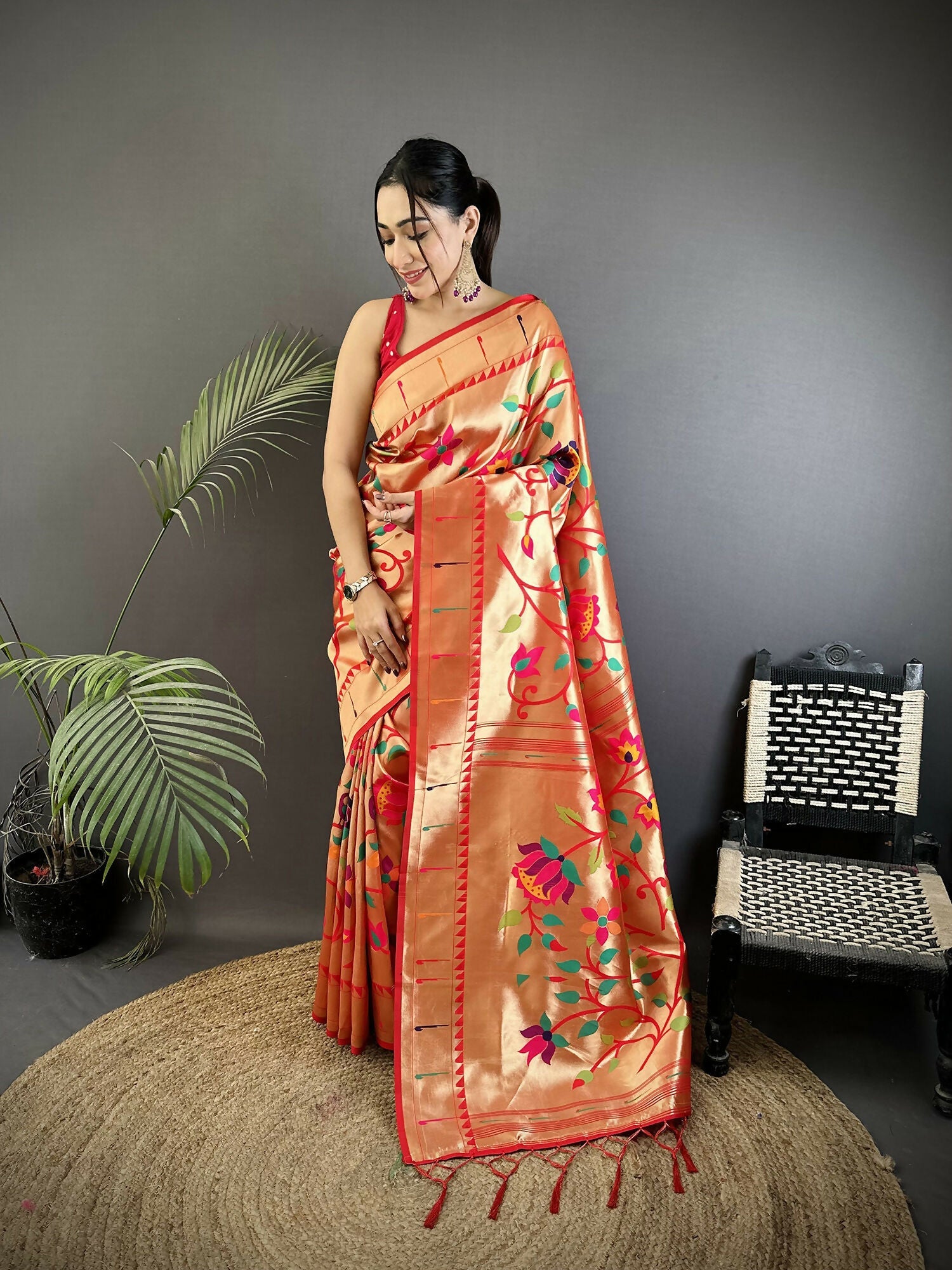 Reddish Pink soft silk Paithani saree with intricate floral and leaf pattern
