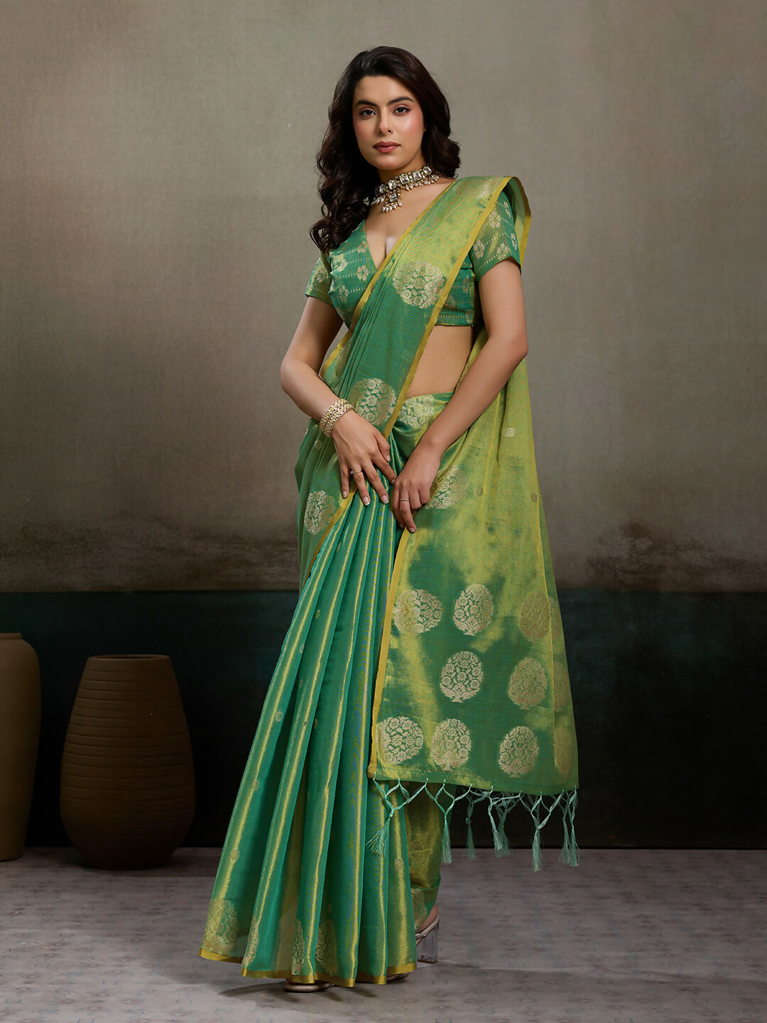 Elegant green tissue silk saree with matching blouse