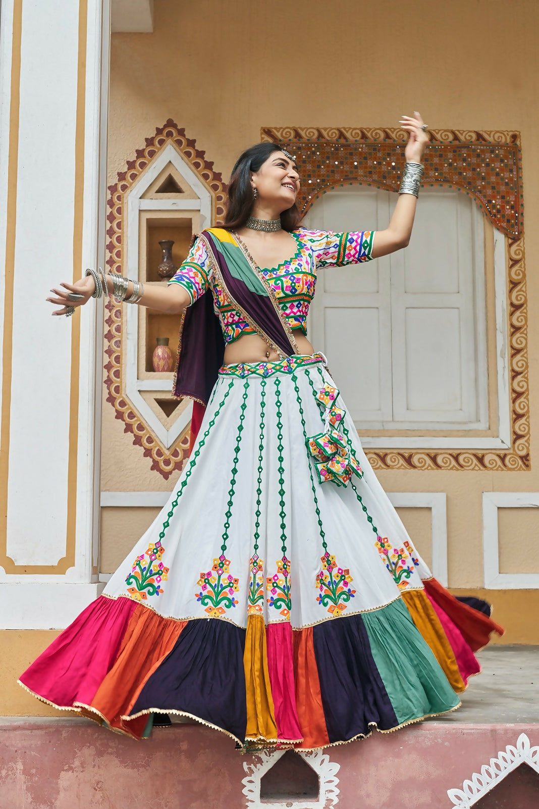 Stunning white viscose rayon lehenga choli with multi-colored dupatta
