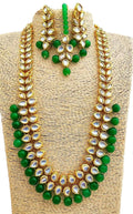 Close up of gold plated Kundan stone necklace set showing craftsmanship