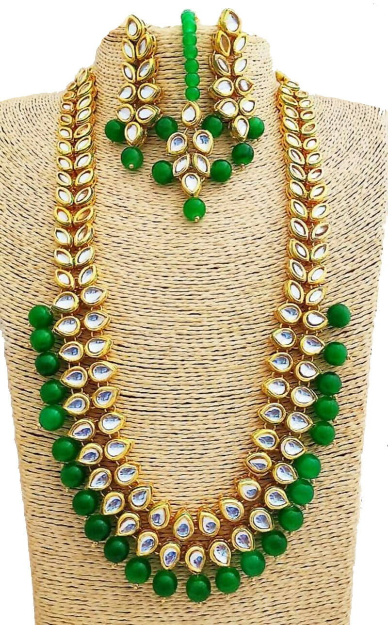 Close up of gold plated Kundan stone necklace set showing craftsmanship