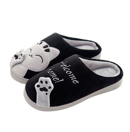 A pair of cozy, slip-on winter house slippers featuring a cute cat design with memory foam insoles.