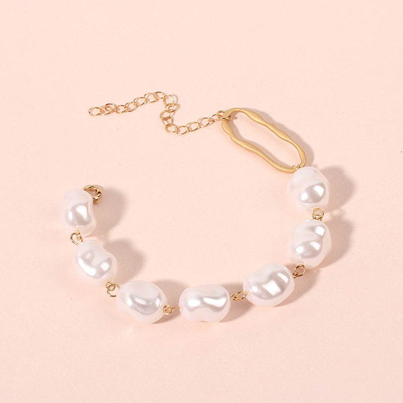Four-Row Pearl Link Chain Bracelet in Gold-Tone Metal