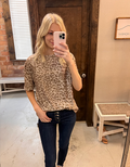 Khaki leopard print short sleeve t-shirt with a round neckline, shown against a neutral background.