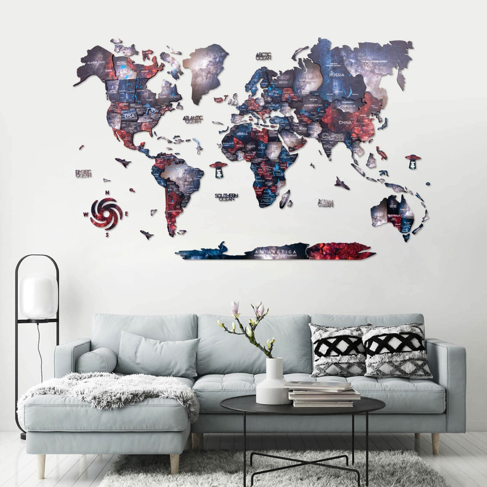 Colorful 3D wooden world map Alcor wall art with blue, red, and black continents.