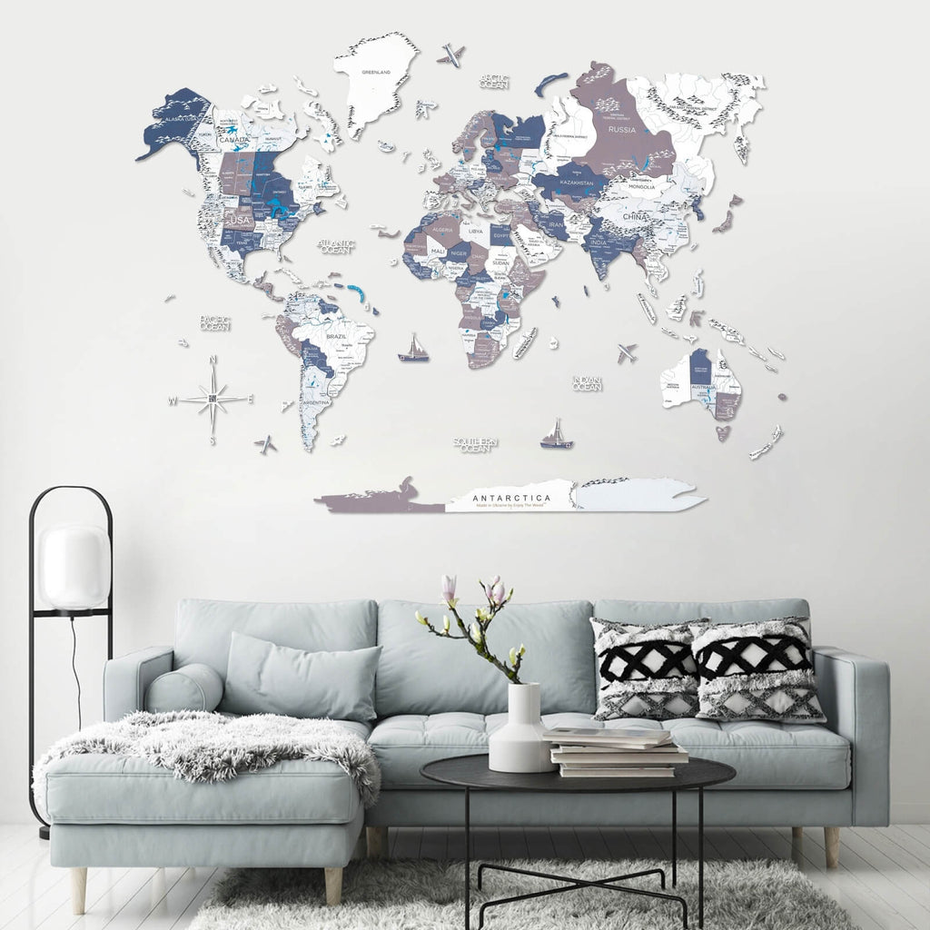 Modern 3D wooden world map in coastal tones of blue, grey, and white.