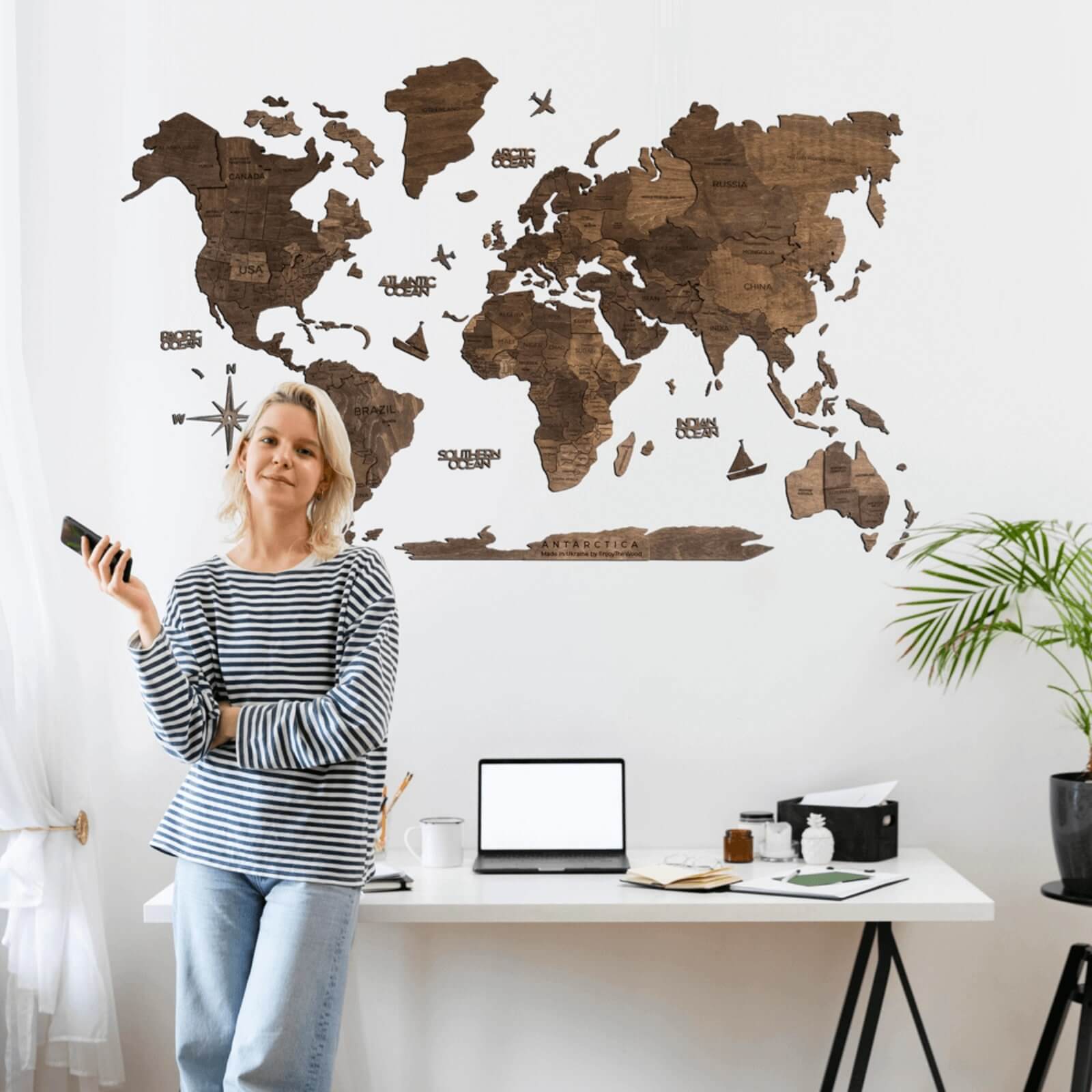 3D dark walnut wooden world map wall art with a modern minimalist aesthetic