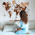 3D multicolor wooden world map installed on a living room wall