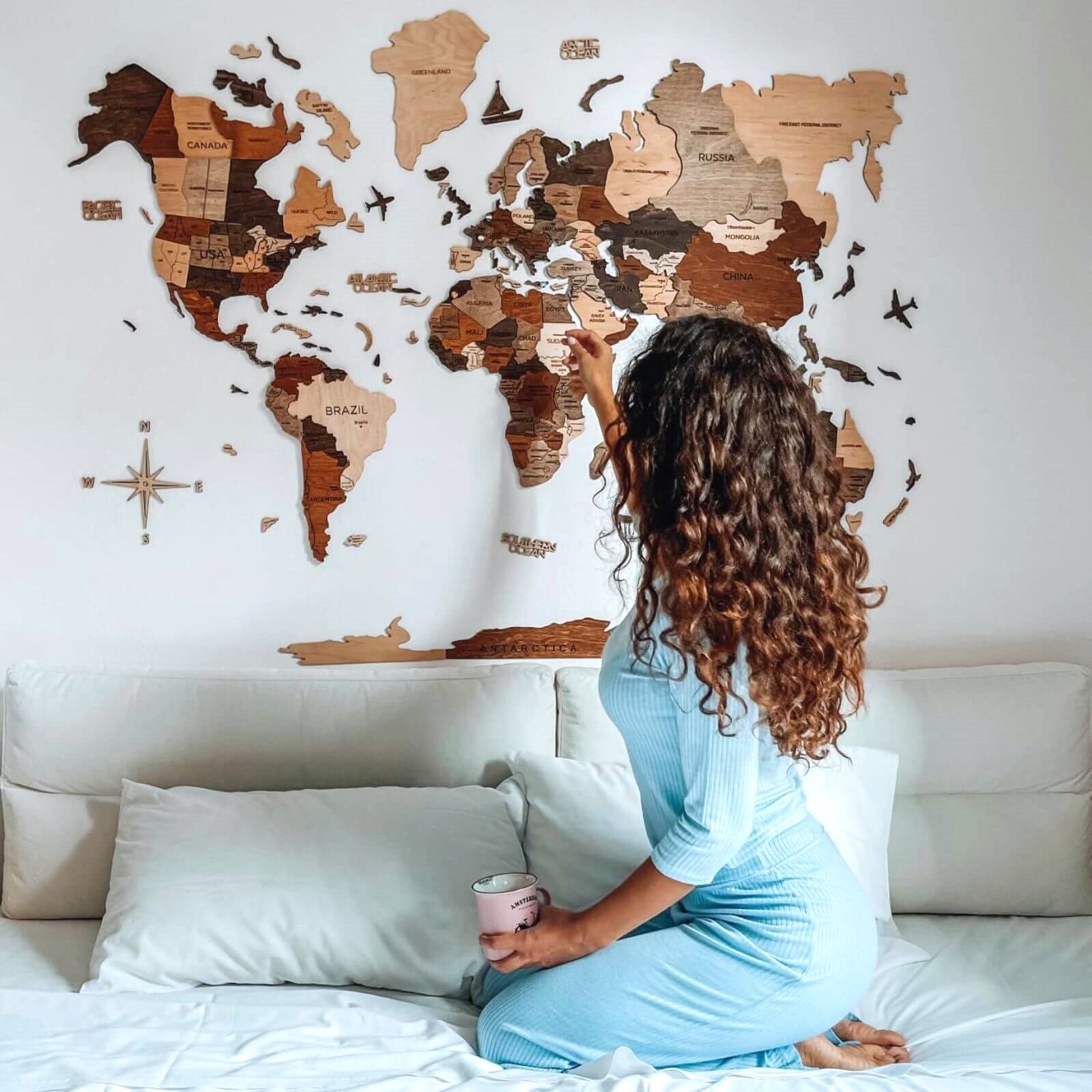 3D multicolor wooden world map installed on a living room wall
