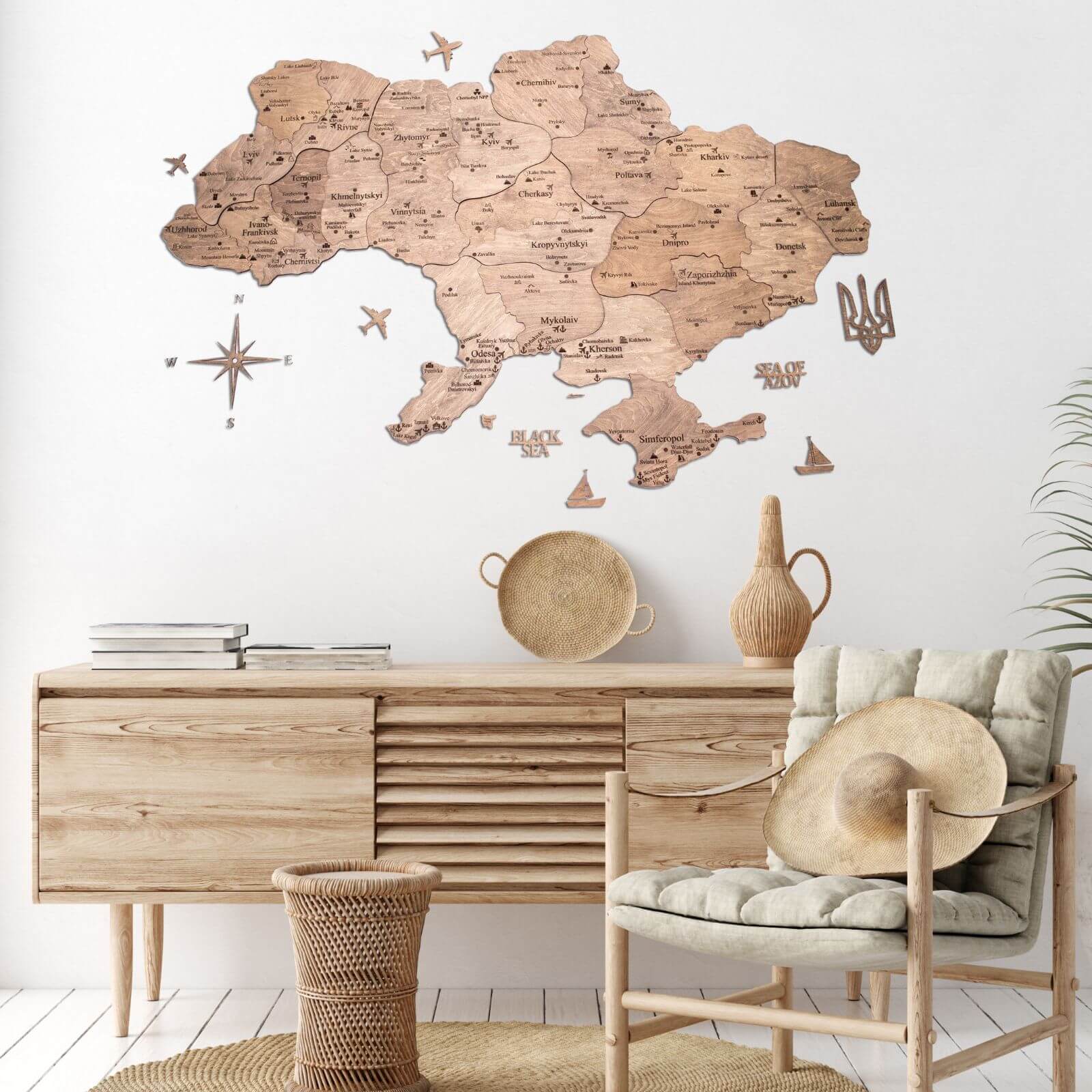 Wooden Map of Ukraine Terra wall art in brown and tan birch wood hanging on a white wall.