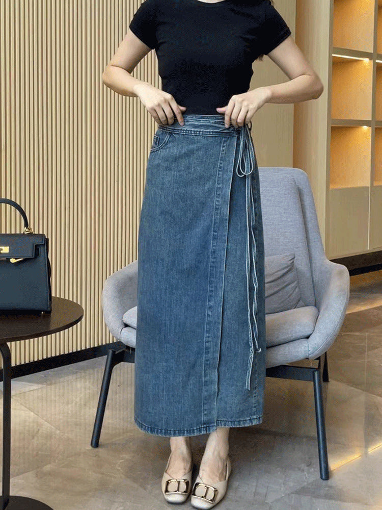 Classic blue denim mid-length skirt with a modern waist slit detail.