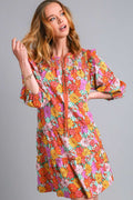 Feminine floral print tiered dress with ruffled details and tie neck