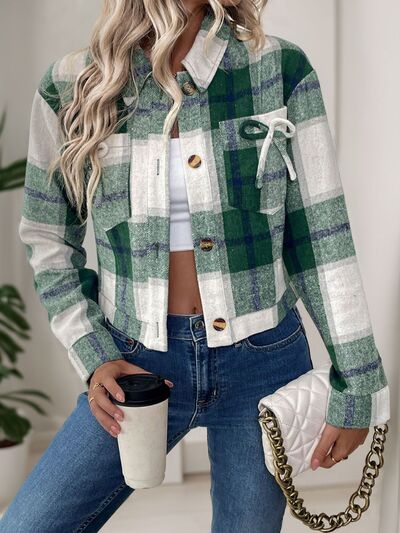 Girl's dark green button-up jacket featuring a decorative bow, front pockets, and a trendy chic design.