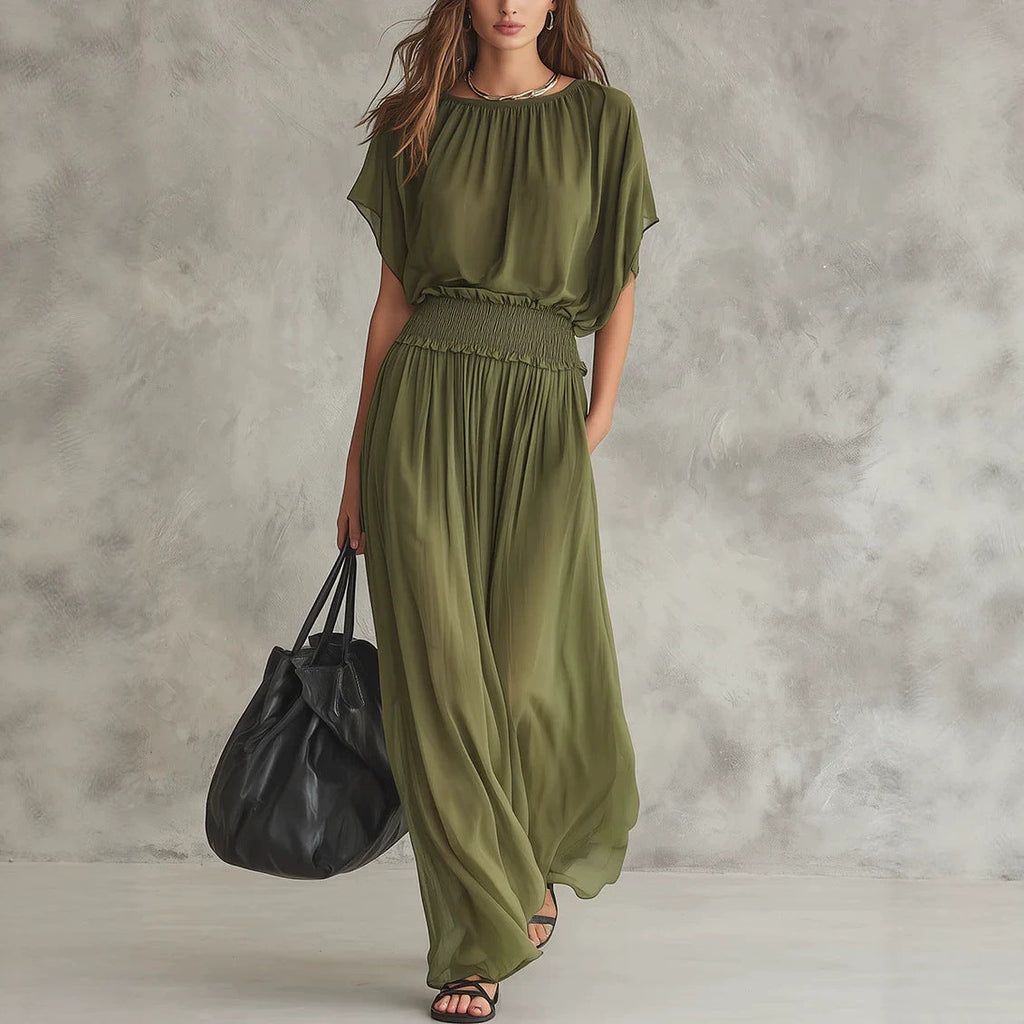 Women wearing a flowing chiffon high-waist maxi dress with ruched detailing