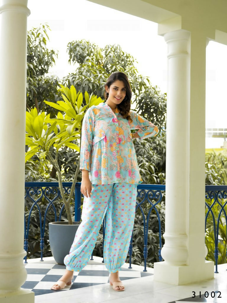 Manya co-ord set featuring a multi-colored top and sky blue muslin cotton pants.