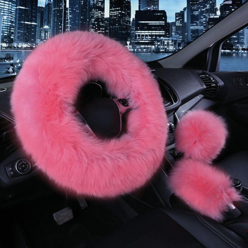 A 3-piece fluffy blue sheepskin steering wheel cover set including matching gear shift and handbrake covers