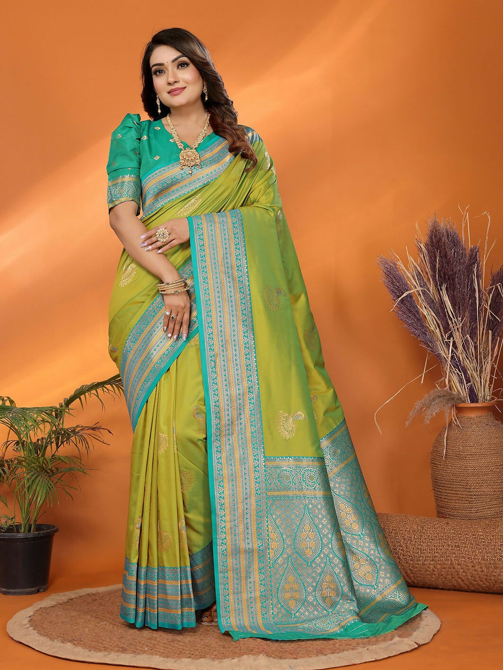 Light green Banarasi soft silk saree decorated with small butti motifs and included blouse piece