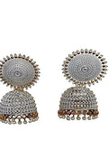 Close-up of gold-plated Meenakari Jhumka earrings in grey with pearl accents