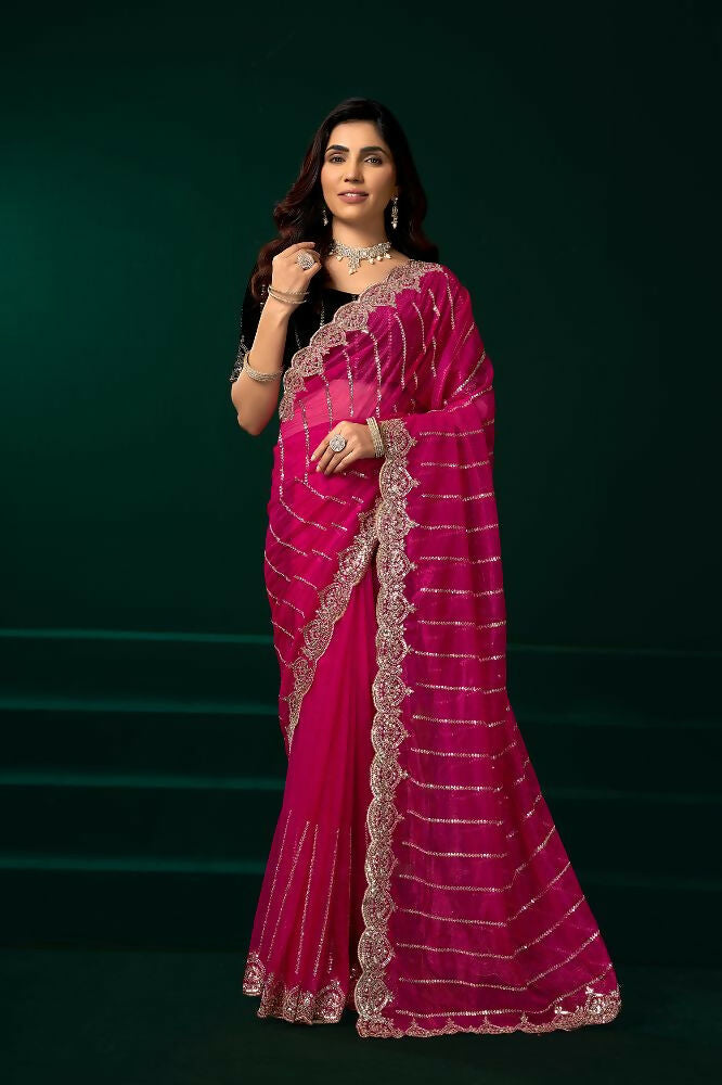 Rani Pink net saree with contrasting black velvet blouse
